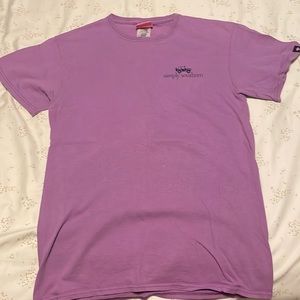 Purple shirt with pink and teal design on back